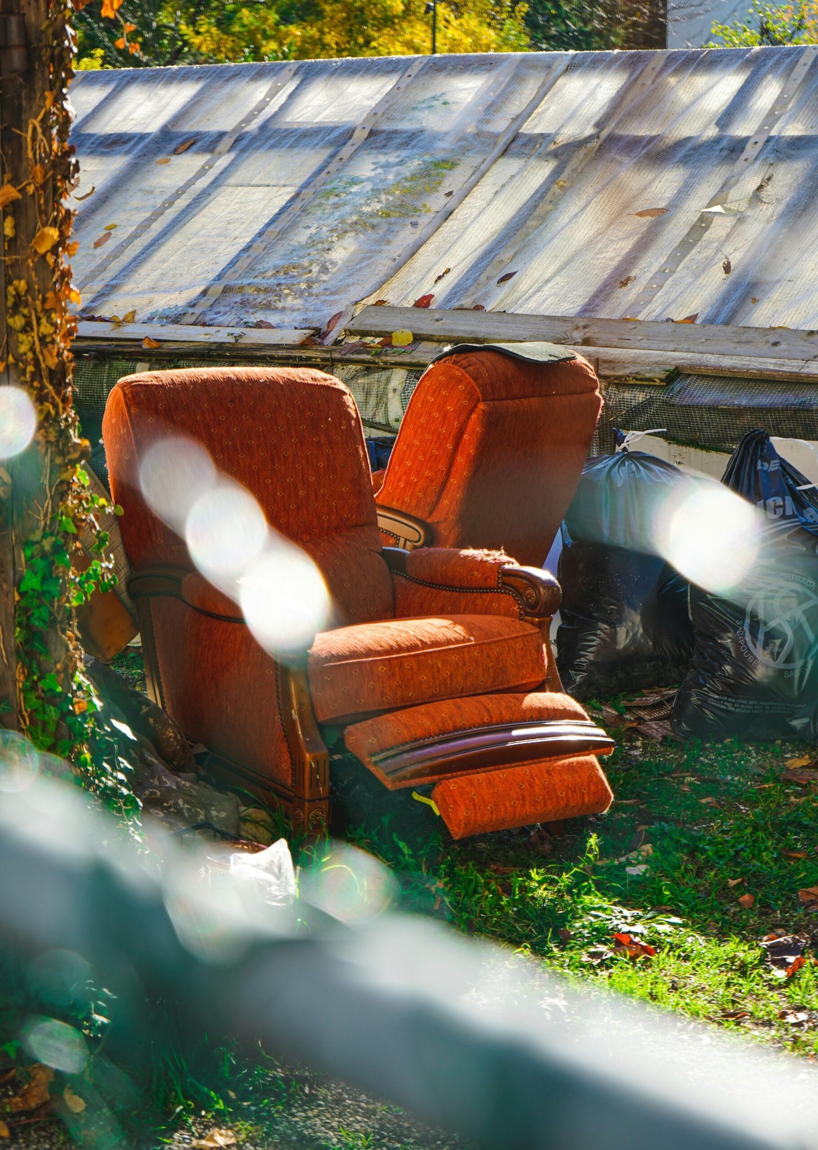a-chair-outside-with-a-wood-fence-in-the-back-scaled-1 دليل شراء الأثاث المستعمل في الرياض